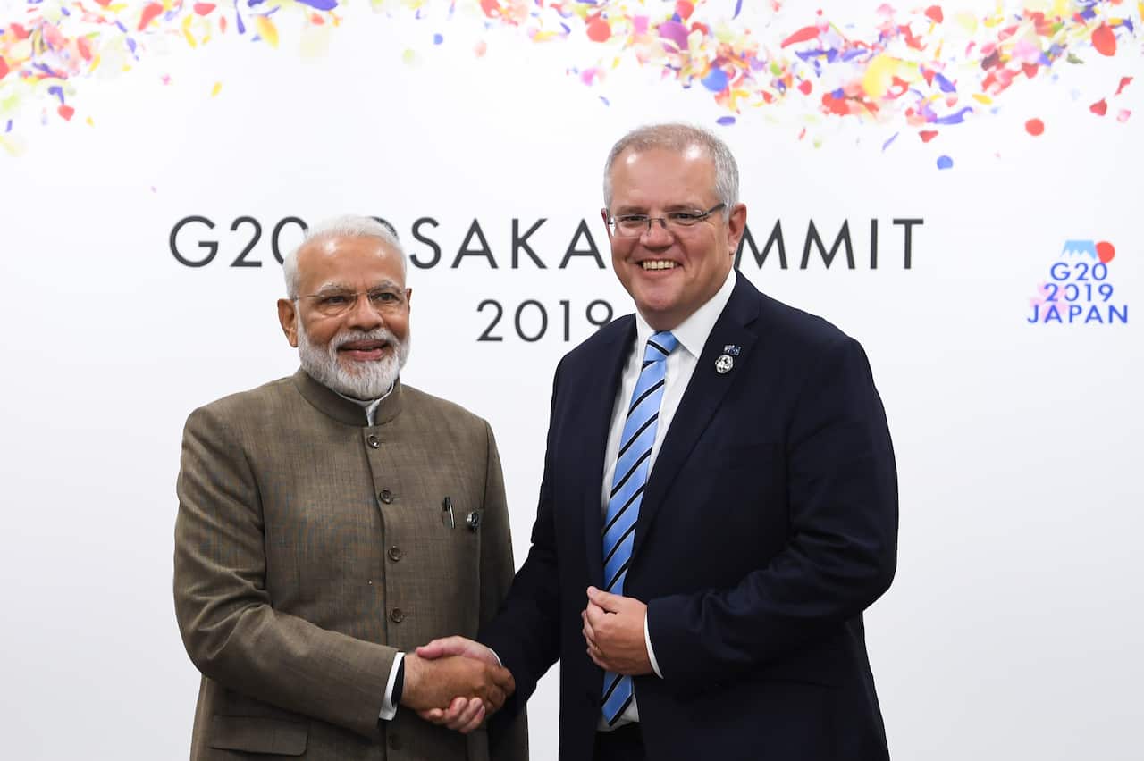 Prime Minister Scott Morrison (right) shakes hands with Indian Prime Minister Narendra Modi during a bilateral meeting at the G20 summit in Osaka, Japan.