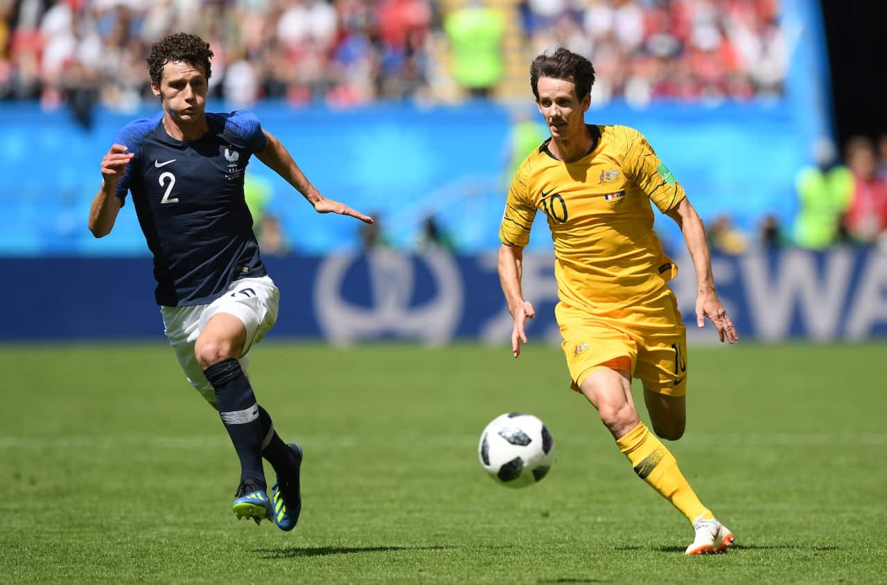 Benjamin Pavard of France and Robbie Kruse of Australia battle for the ball during the 2018 FIFA World Cup Russia group C 