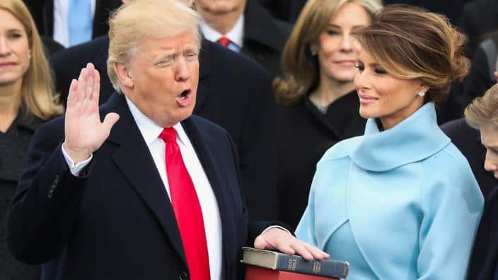 Donald Trump is sworn in as the 45th president of the United States as Melania Trump looks on during the 58th Presidential Inauguration