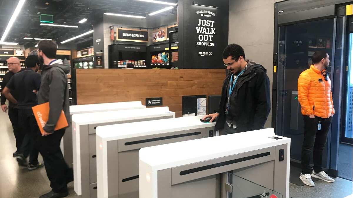 A shopper scans a smartphone app associated with his Amazon account and credit card information to enter the Amazon Go store in Seattle, Washington, U.S., January 18, 2018.