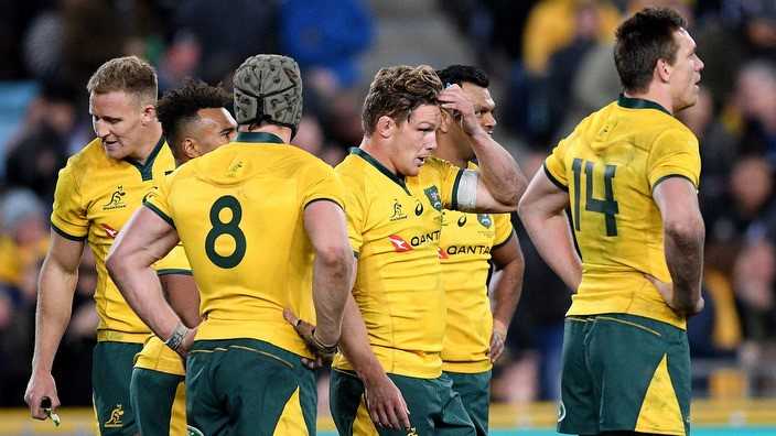 Australia's men's national rugby union players dejected during their defeat to New Zealand