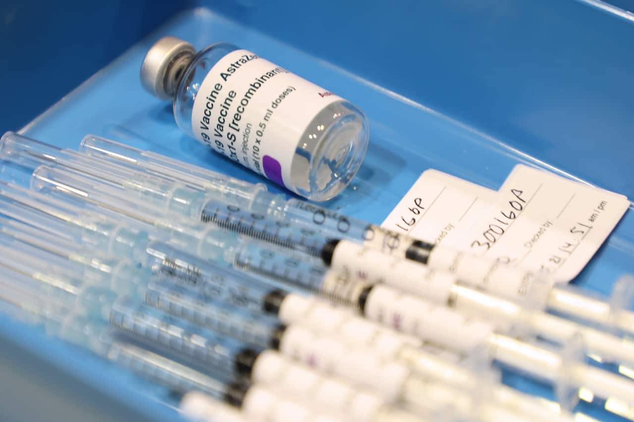 Drawn up syringes containing the AstraZeneca COVID-19 vaccines and the empty vial