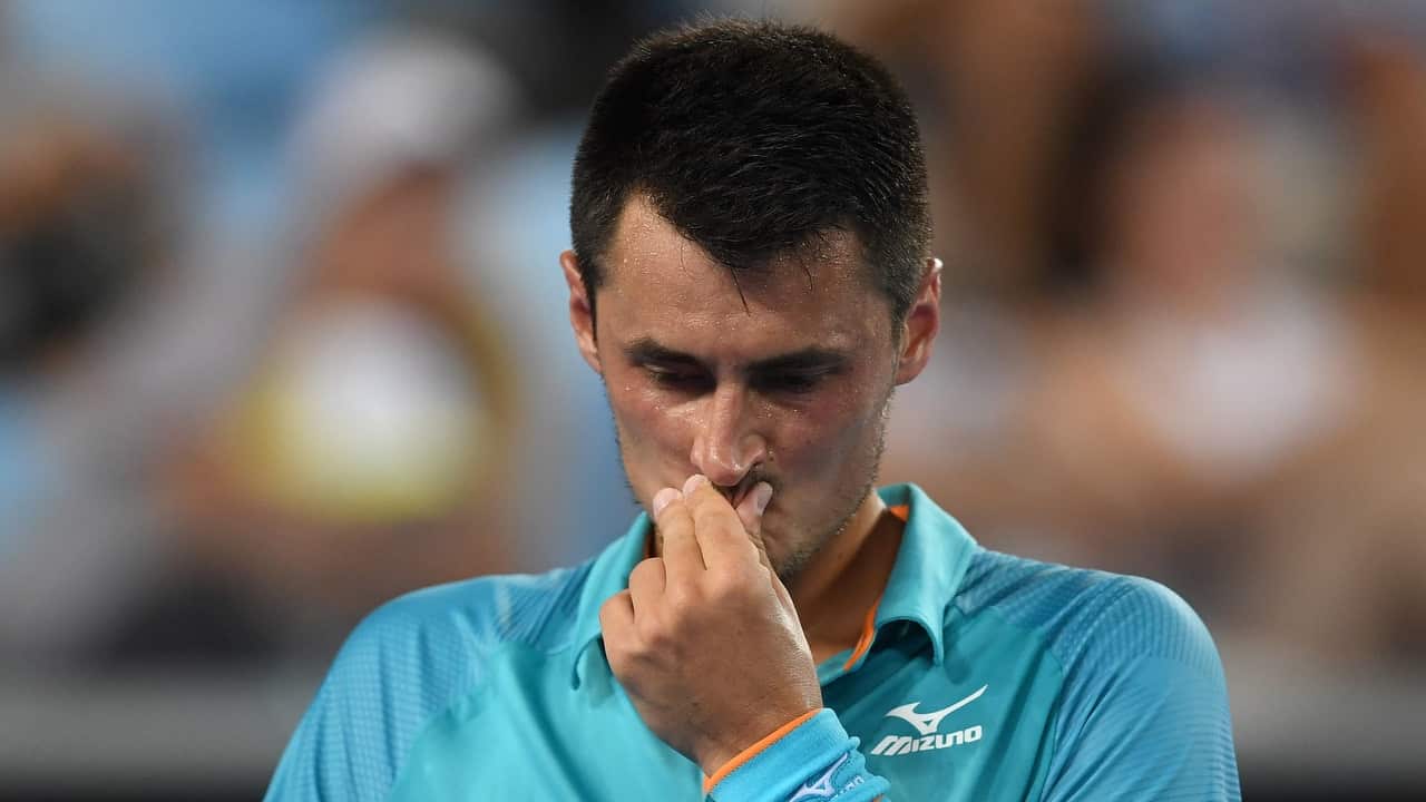 Bernard Tomic of Australia in action against Marin Cilic of Croatia during day one of the Australian Open tennis tournament in Melbourne.