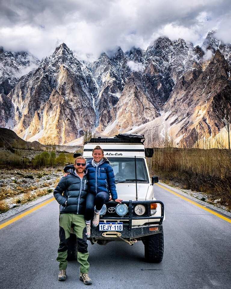The nomadic couple stop for a photo on the Karakoram Highway.
