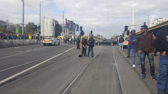 An estimated tens of thousands of workers began marching from Trades Hall to Flinders Street Station, disrupting traffic and public transport.