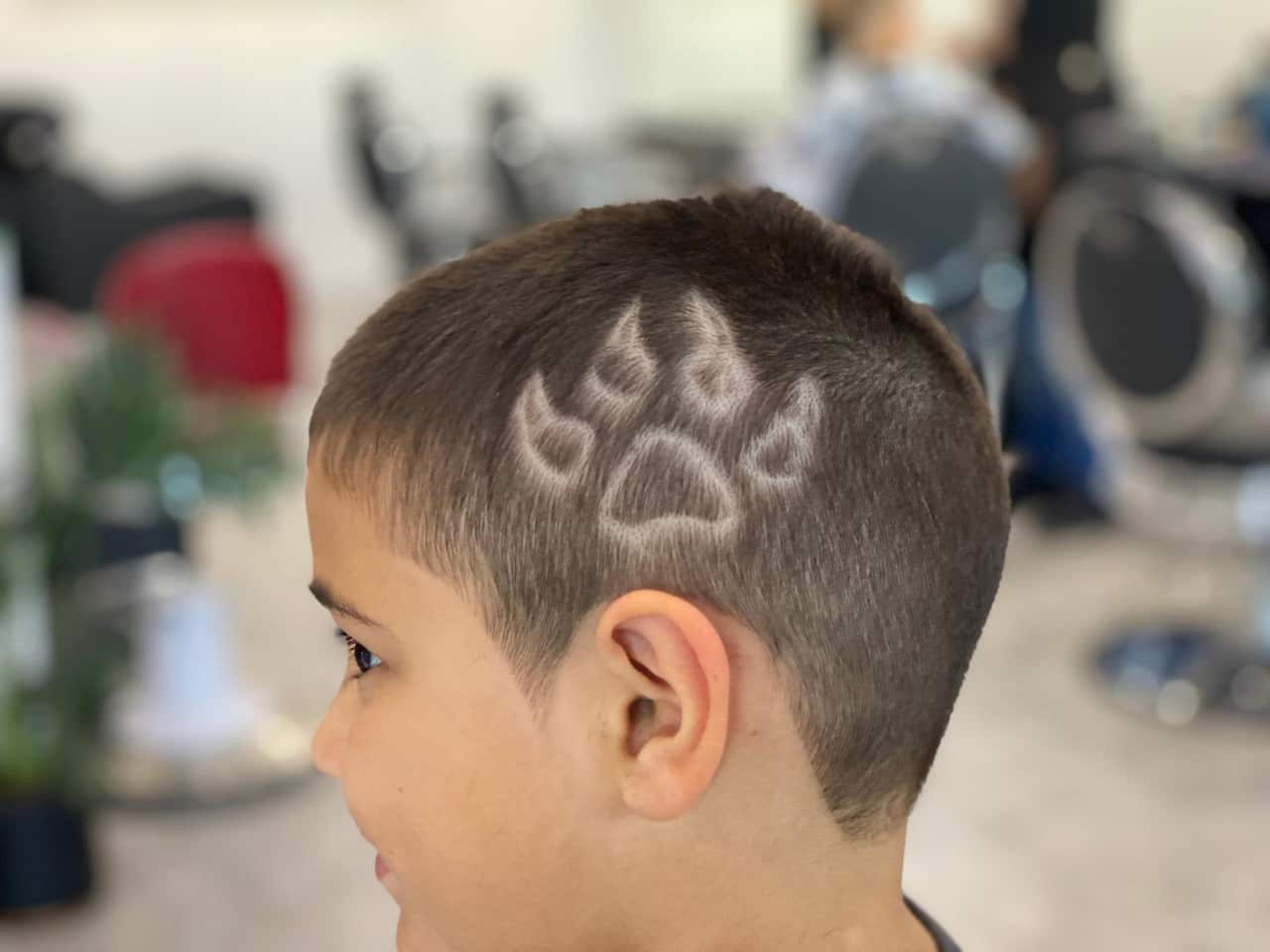 A kid's haircut by Walkabout Barber