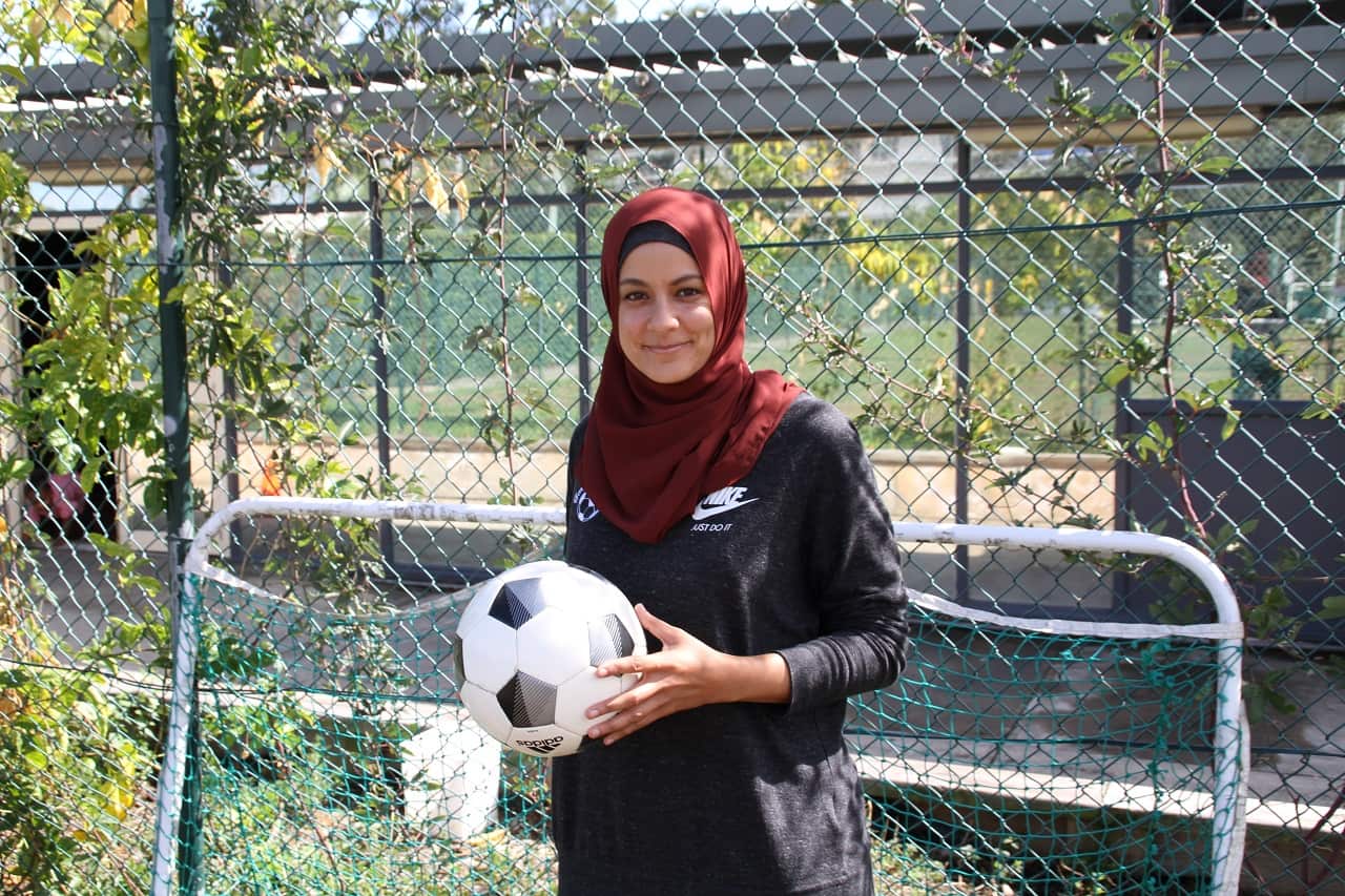 Assmaah Helal helps young people get involved in the game of football through her work with Football United.