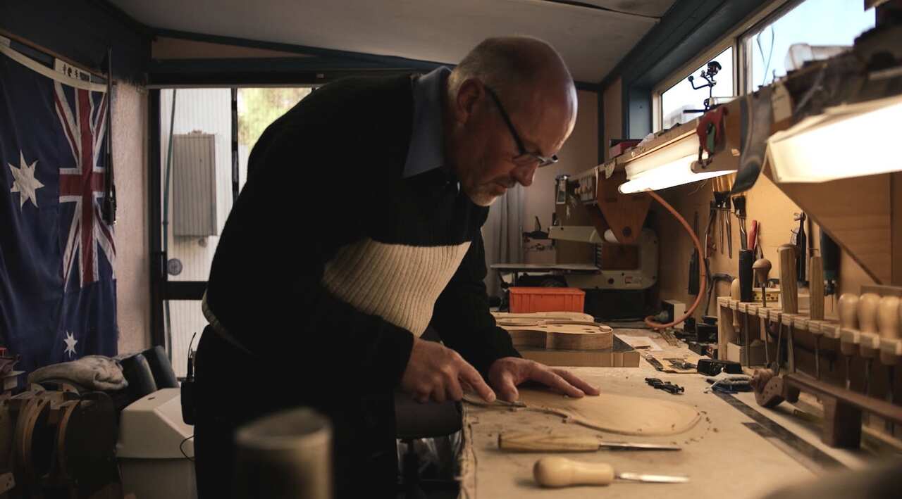 Peter Reid builds instruments in a shed behind his home in Orange, NSW.