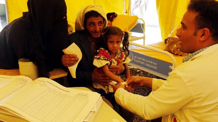 A cholera-infected Yemeni child receives treatment amid an acute cholera outbreak, inside a makeshift tent at a hospital in Sana’a
