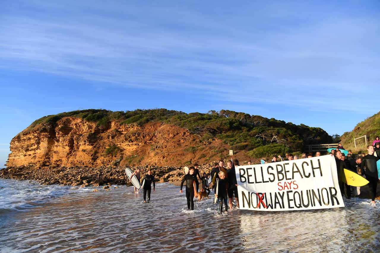 Surfers take part in a National Day of Action against Norwegian oil giant Equinor.