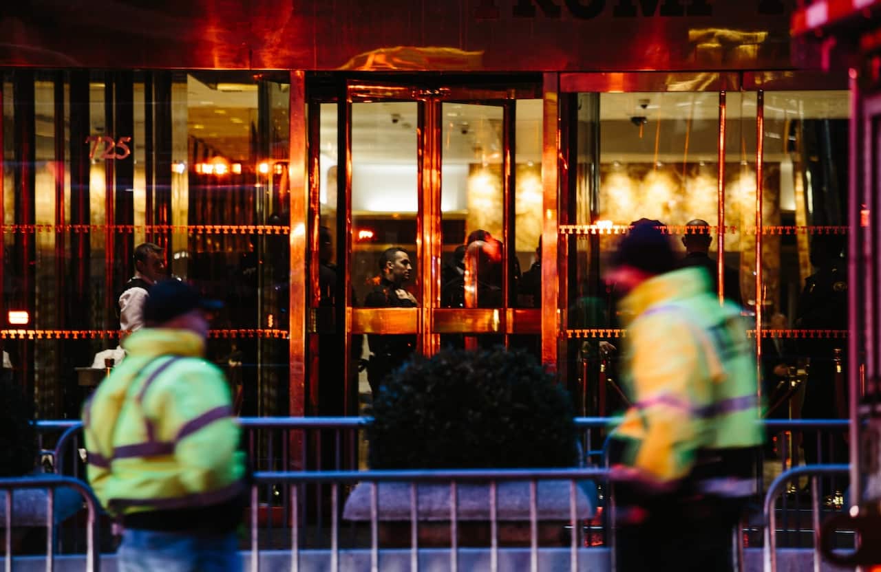 New York Fire Department and New York Police Department personnel operate during a four-alarm fire that broke out