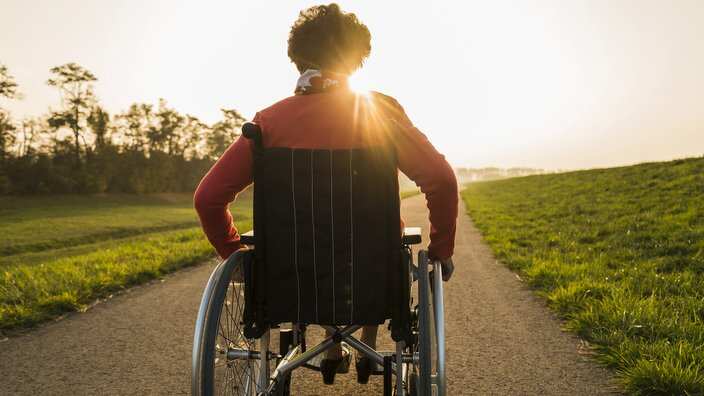 Senior woman in wheelchair in the nature