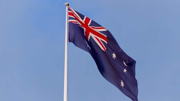 Low Angle View Of Australian Flag Against Blue Sky