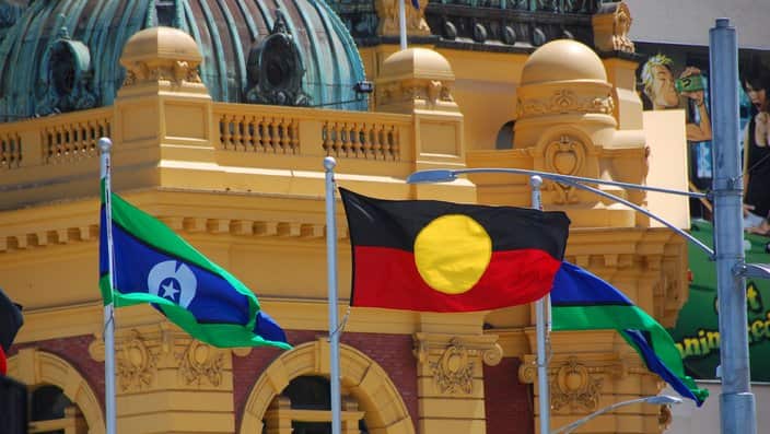 Aboriginal and Torres Strait Islander flags flown in front of Flinders street station, Melbourne