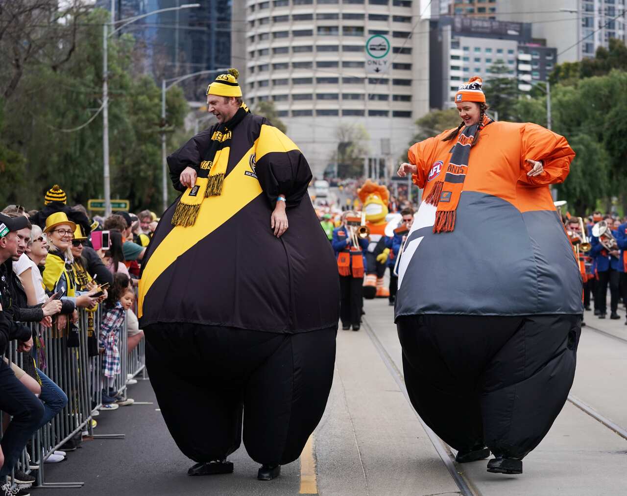 Tigers and GWS mascots take part during the AFL Grand Final Parade in Melbourne, Friday, September 27, 2019. (AAP Image/Michael Dodge) NO ARCHIVING