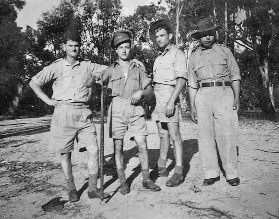 Members of 6th Employment Company with snake. From left: George Collins, Nicholas Raftopoulos, Con Vlasopoulos and Gery Valianos.Tocumwal, 1942.