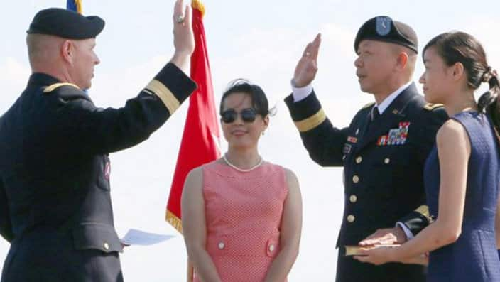 Lapthe C. Flora sworn in as Brig. Gen. on 6/6/2016, at the National D-Day Memorial in Bedford, Virginia, witnessed by his wife, Thuy and daughter, Christine.