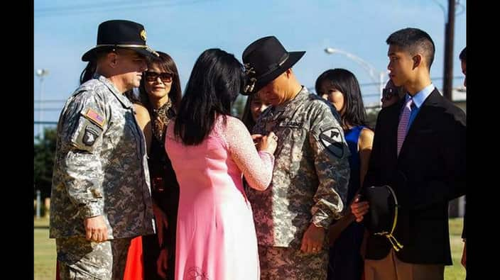 LTG Mark Milley (L), Commander III Corps looks on as Kim pinned star her husband BG Luong, witnessed by sister Minh, and daughter Jacqueline, and son Brandon. 