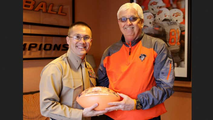 U.S. Marine Corps Director of Intelligence, Brig. Gen. William H. Seely III, poses with Mack Butler, director of football operations at OSU on 17 Feb 2017.