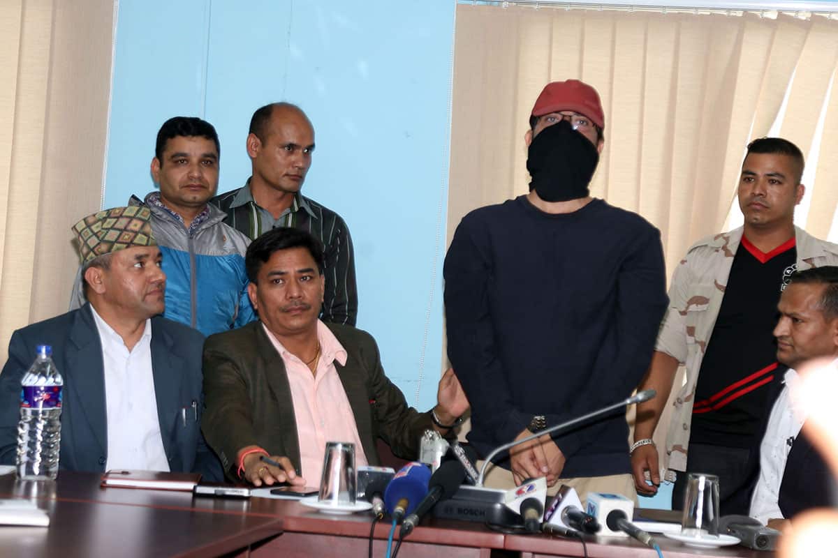 Alleged gold trafficker Churamani Uprety AKA Goray presented by Nepal police at a press conference in Kathmandu after his arrest.