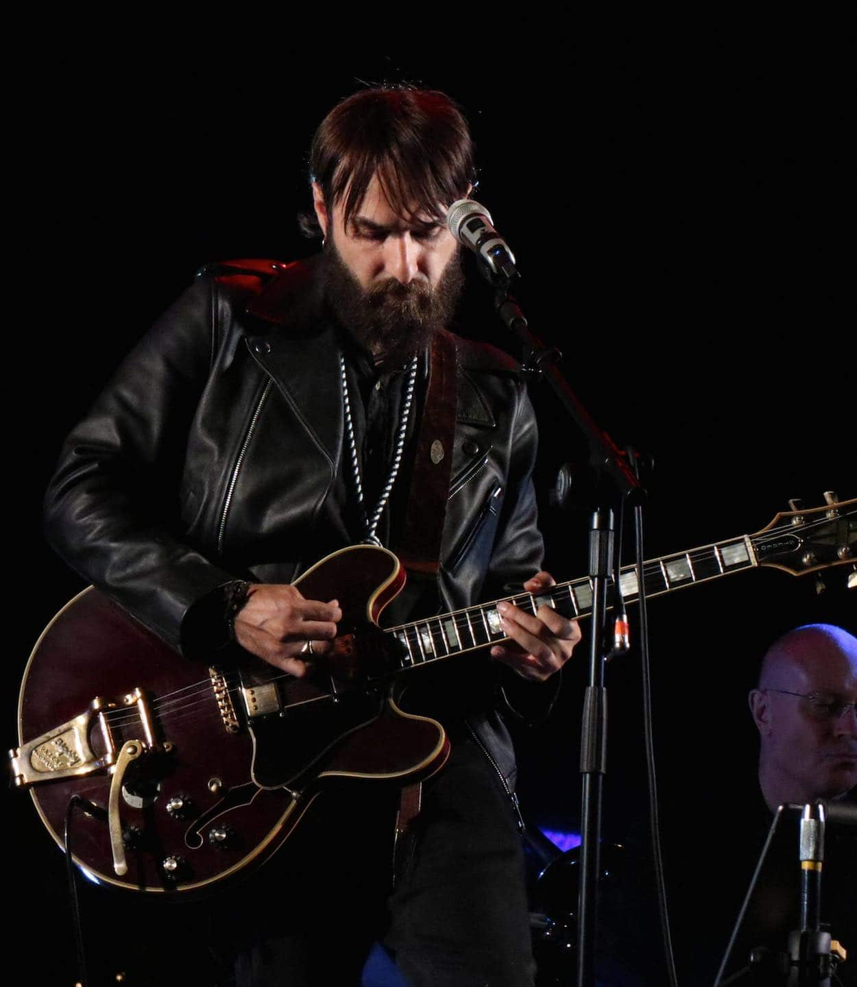 Image of Ivan Graziani singing and playing at the Sanremo Music Festival