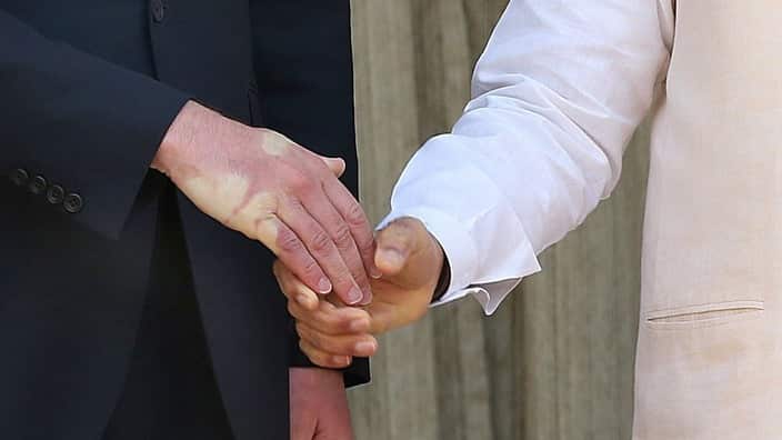A strong handshake  by Indian prime minister Nanrendra Modi leave a impression at the Britain's Prince William's hand prior to a meeting  at Hyderabad House in New Delhi, India 12 April 2016. Prince William and his wife Catherine are on a visit to India a
