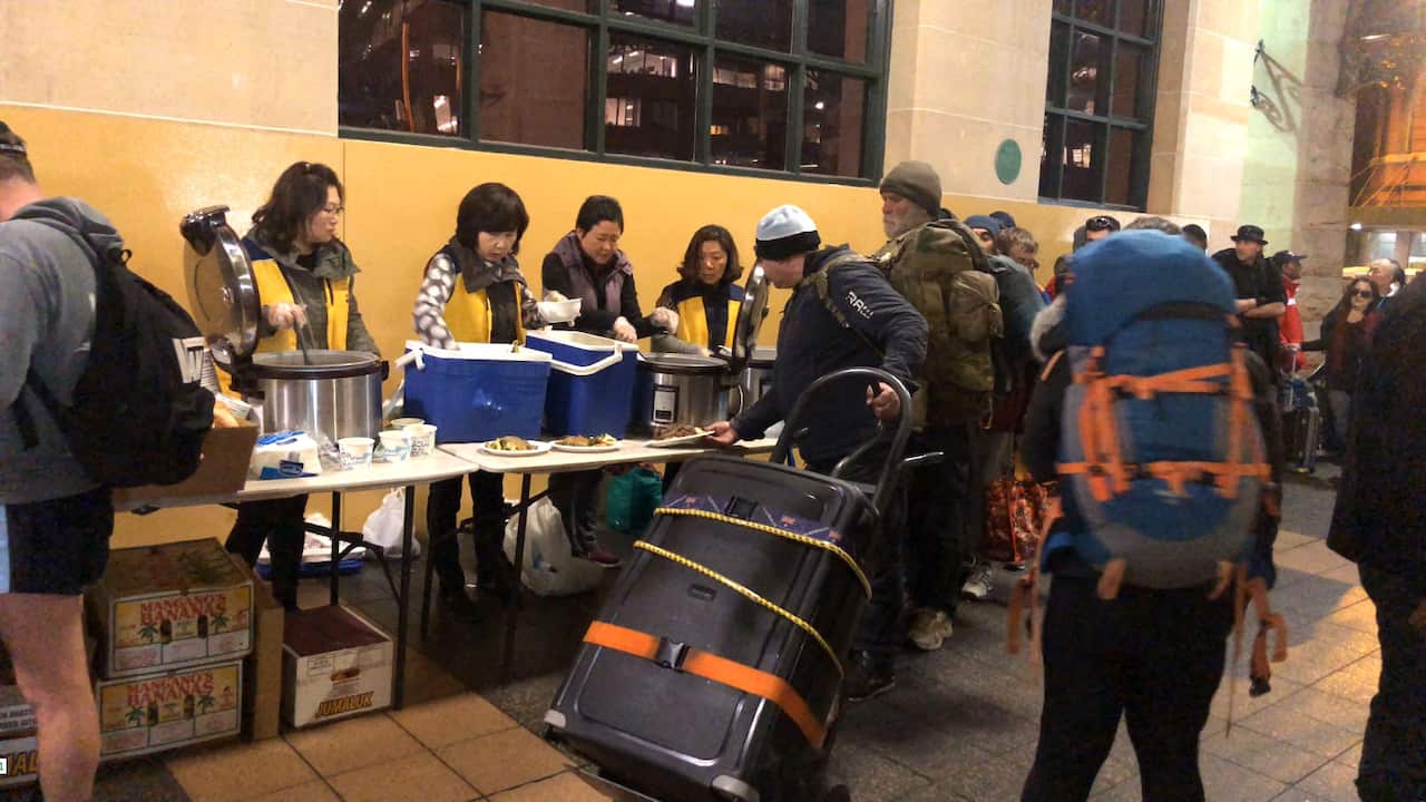 About 3,000 migrants of Korean heritage interchangeably take part in the exercise of offering a warm dinner six days a week in front of the iconic train station