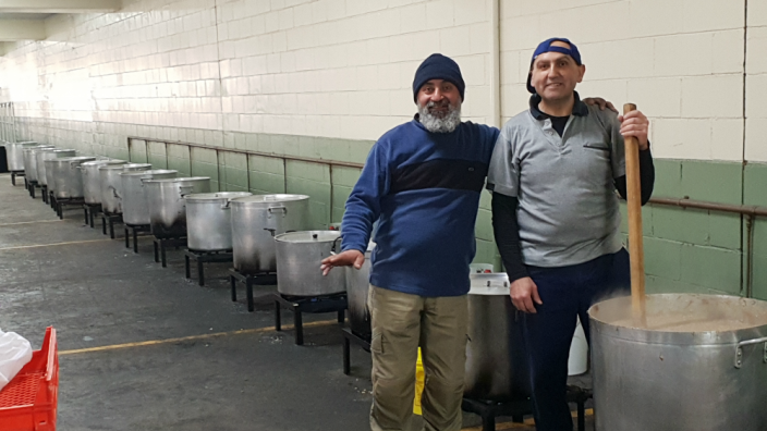 Volunteers cooking at a church event