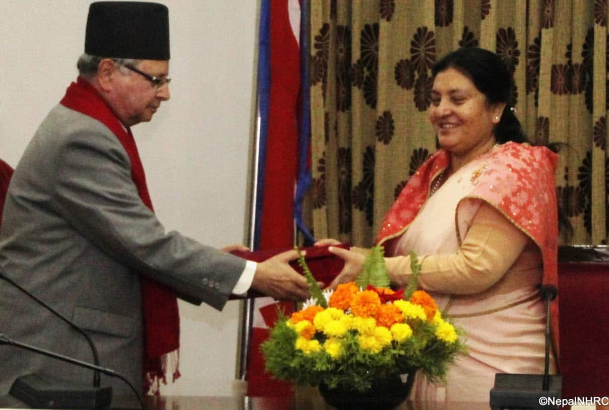 Nepal's President Bidhya Devi Bhandari receiving annual report from Nepal Human Rights Commission Chairman Anup Raj Sharma.