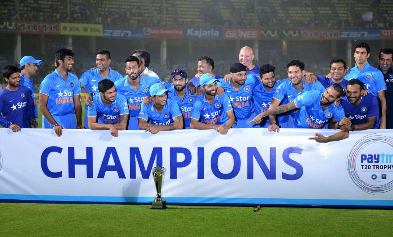 Indian cricket team poses with paytm champions Trophy during the third T20 international match between India and Sri Lanka at the Dr. Y.S. Rajasekhara Reddy ACA-VDCA Cricket Stadium in Visakhapatnam on February 14, 2016. India won the series with 2-1. 