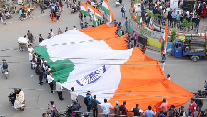 People celebrate the reports of IAF air strikes across LoC.