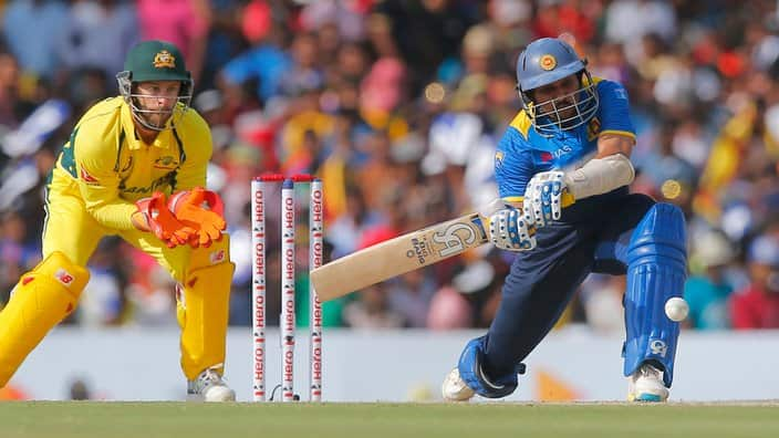 Sri Lanka's Tillakaratne Dilshan plays a shot against Australia as Matthew Wade watches during their third one day international cricket match in Dambulla, Sri Lanka, Sunday, Aug. 28, 2016. (AP Photo/Eranga Jayawardena)