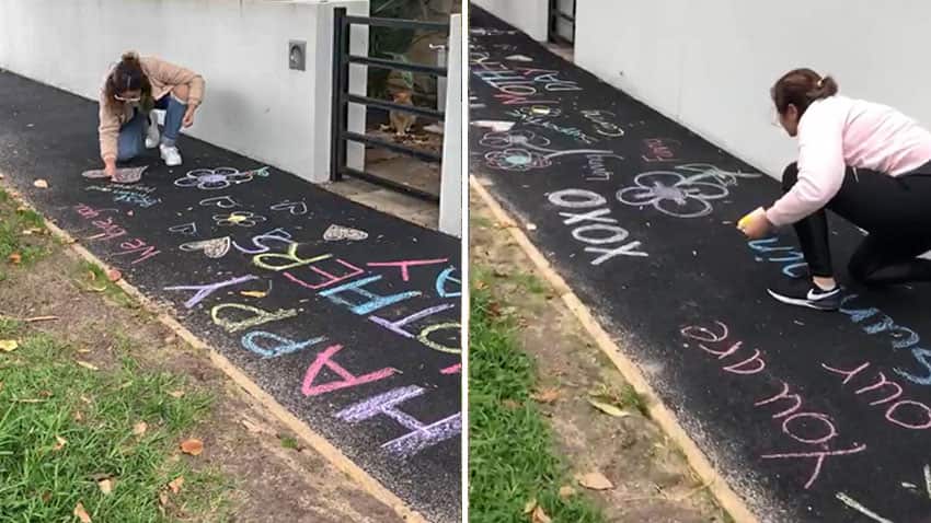 Iman daughters decorating the sidewalk 