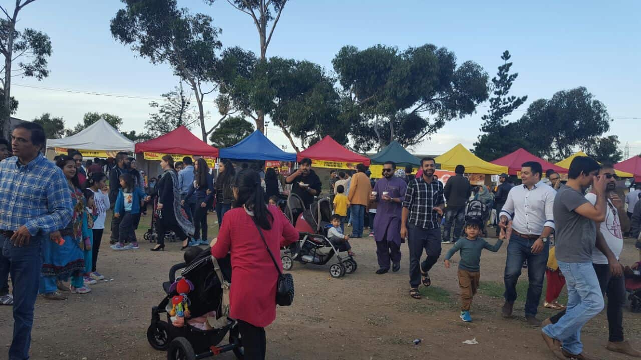 People enjoying food at the Basant festival