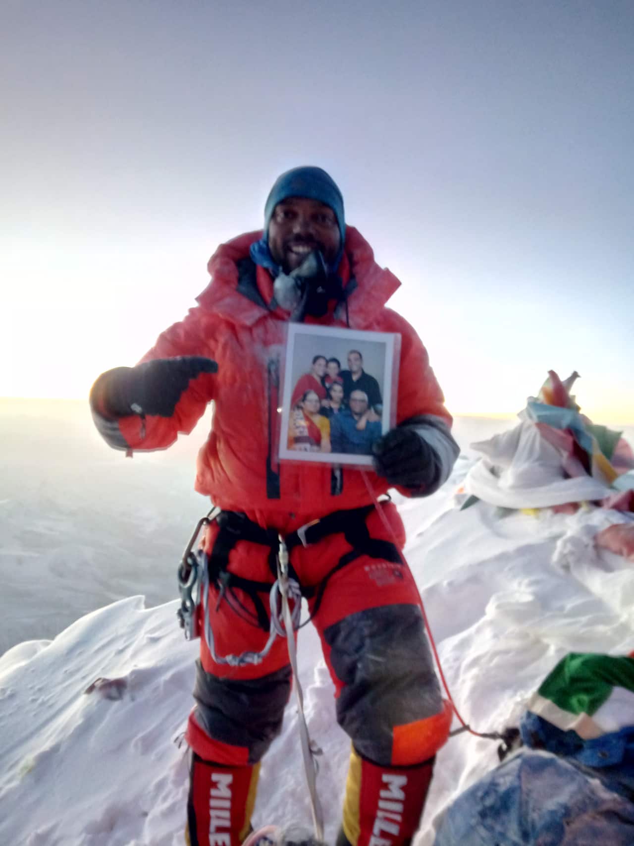 Mehul Joshi with the photo of his family members.