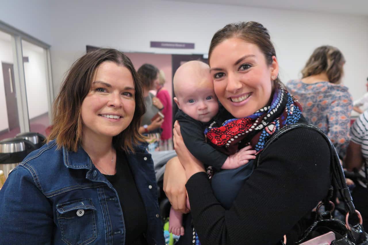 Mum Sarah Smith with midwife Amber Gibson, holding Sarah’s baby Macklin
