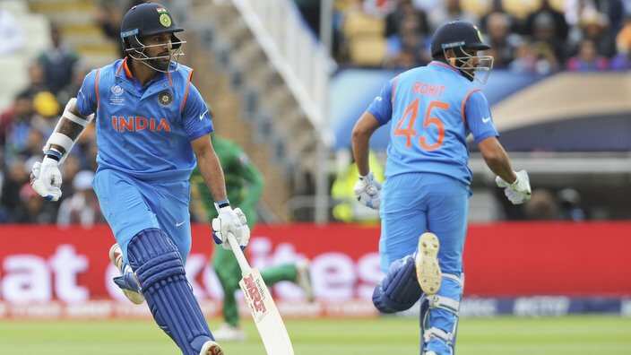 India's Rohit Sharma, right, and Shikhar Dhawan run between wickets during the ICC Champions Trophy match between India and Pakistan at Edgbaston in Birmingham, England, Sunday, June 4, 2017. (AP Photo/Rui Vieira)