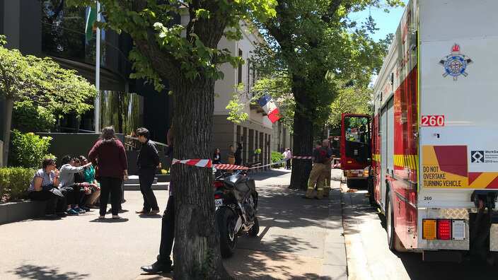 Fire crews are seen outside the Indian Consulate on St Kilda Road in Melbourne