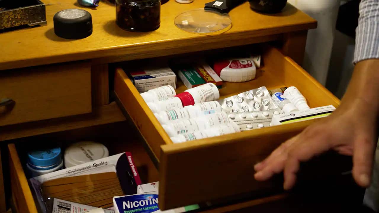 Simon’s bedside table filled with medication to treat his cluster headaches.