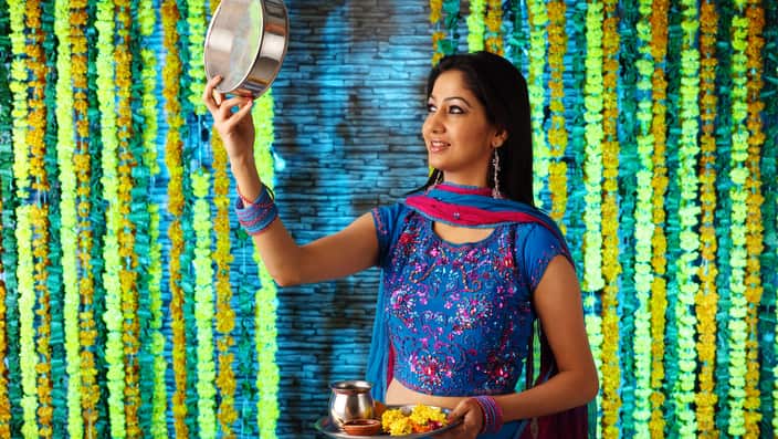 A woman performing a ritual of Karva chauth
