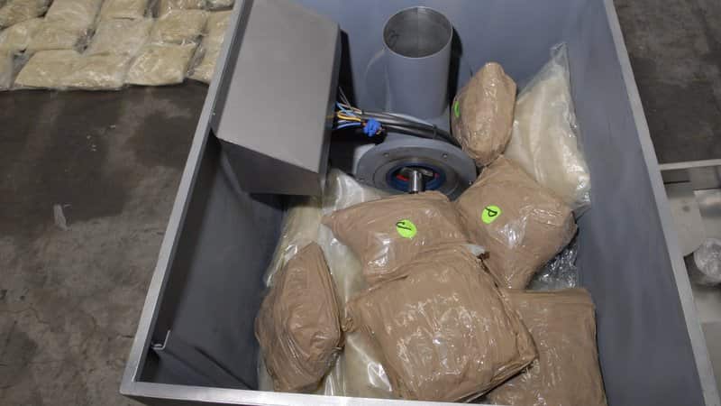 the industrial mincing machines locating approximately 60 packages of a brown granulated substance