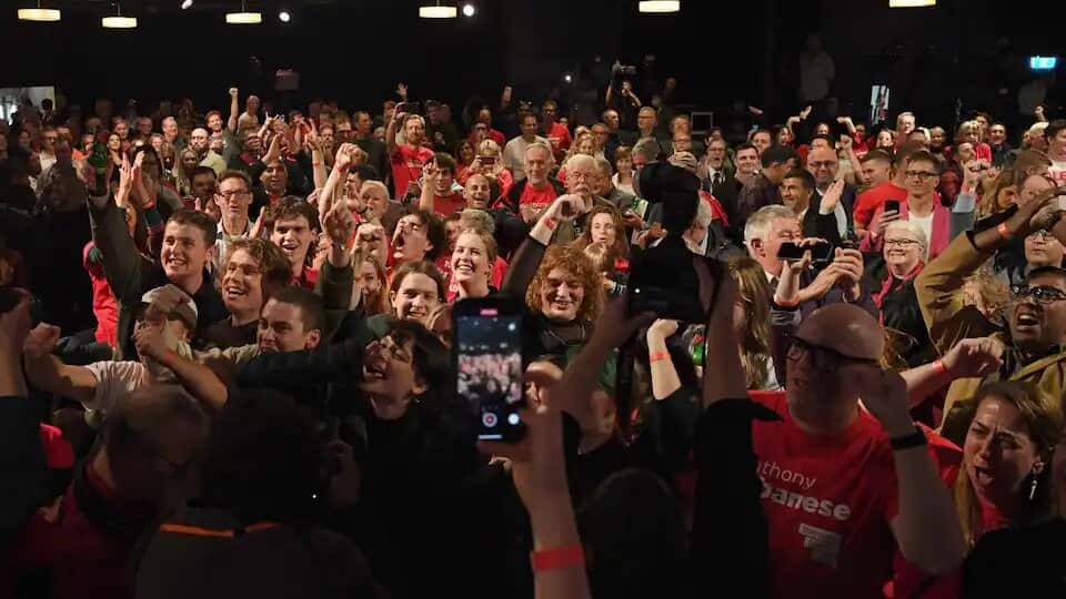 Labor party supporters react as results begin to come in during the 2022 Federal Election