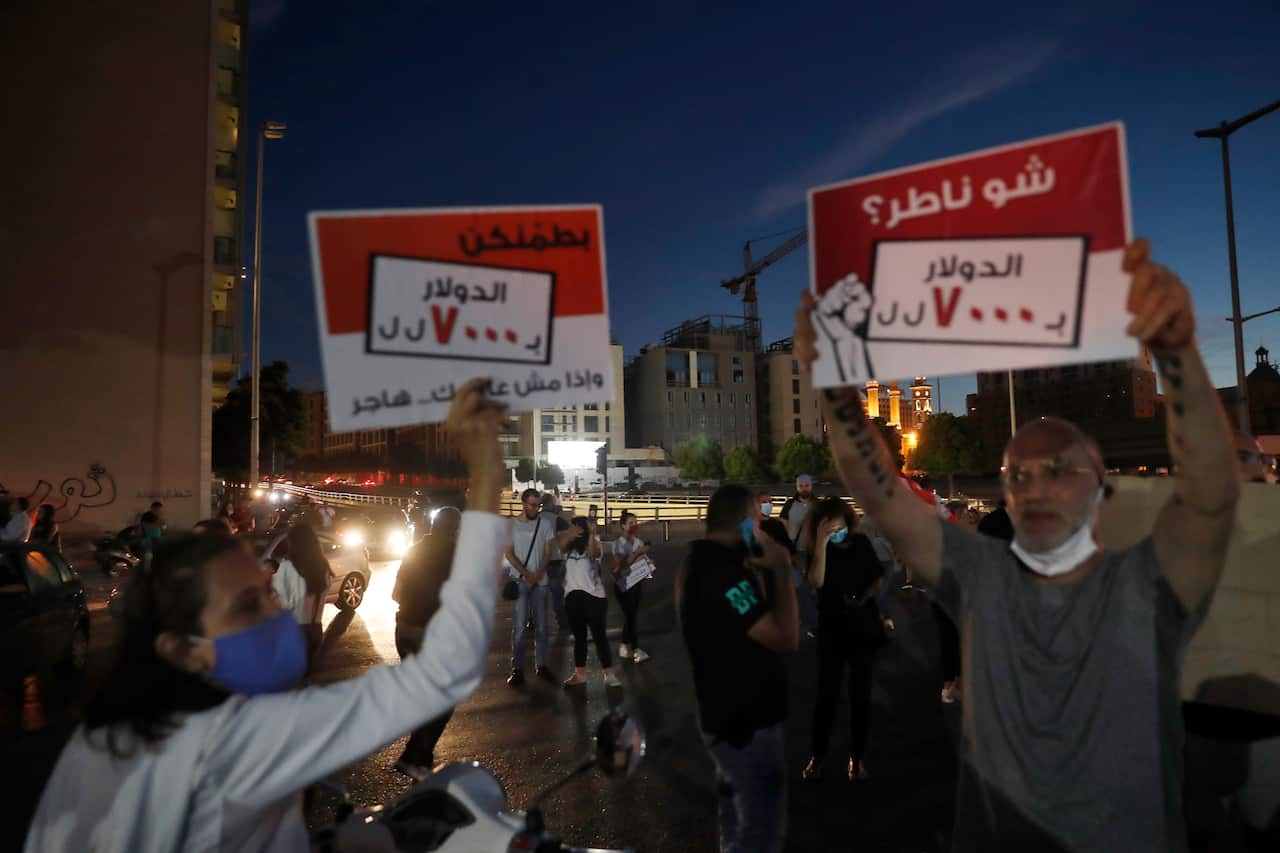 Anti-government protesters in front of the government house in downtown Beirut, Lebanon, Thursday, June 11, 2020.