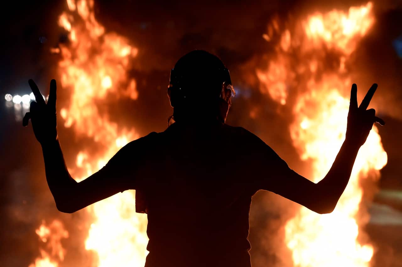 An anti-government protester flashes the victory sign  during a protest against economic condition,  Lebanon, 11 June 2020. 