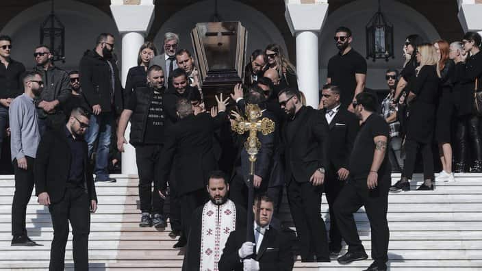 The coffin of slain Greek Australian John Macris is carried out of an Orthodox church after his funeral ceremony, at Voula.
