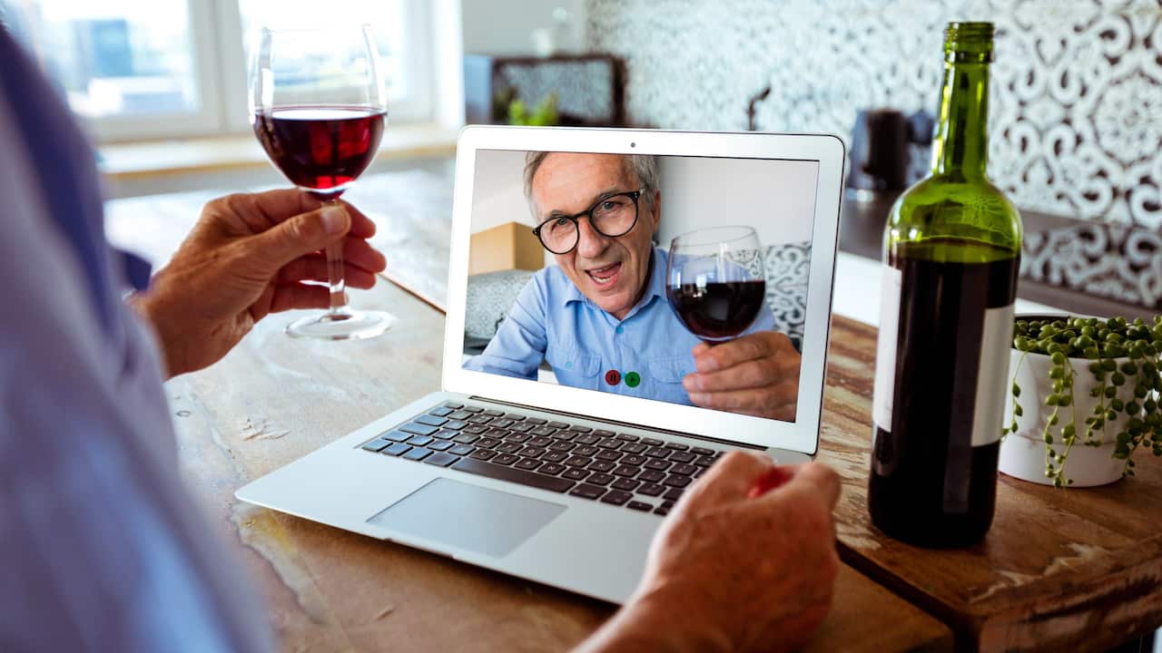 man_on_zoom_with_wine