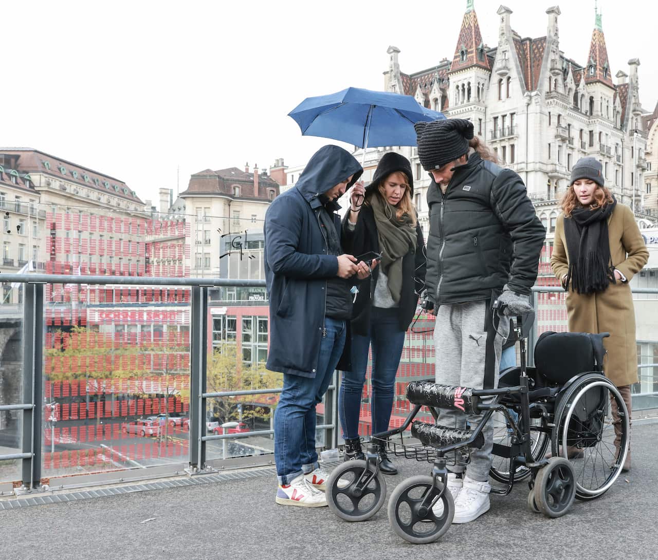 Michel Roccati in central Lausanne leaving his wheelchair and standing up