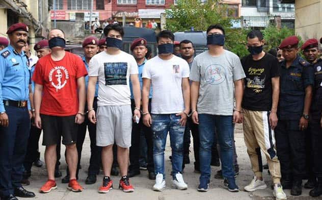Nepal Police say the Chinese nationals are accused of using fake cards to withdraw money from ATMs in Kathmandu.