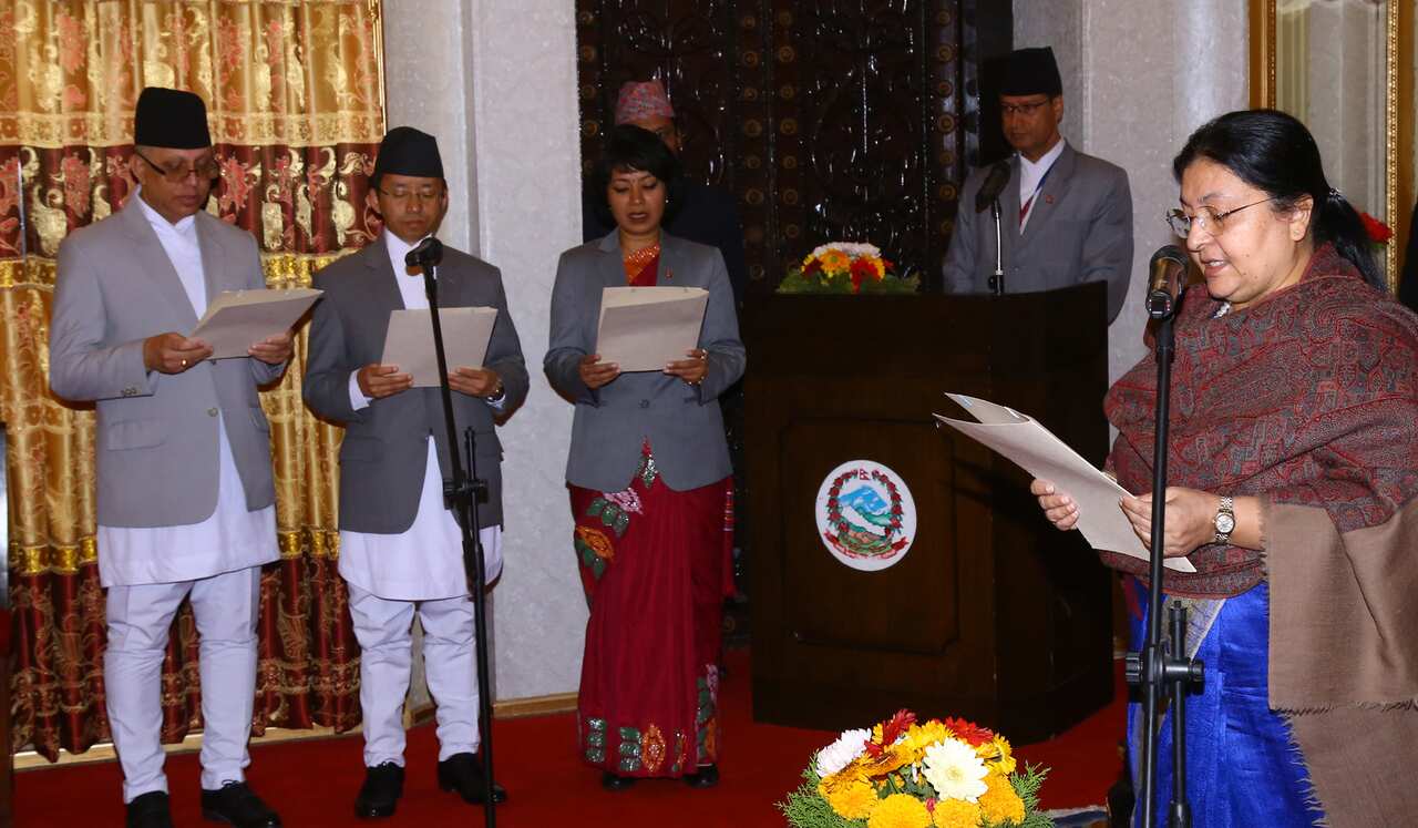 President Bidhya Devi Bhandari administering oath of office to Nepali ambassadors.