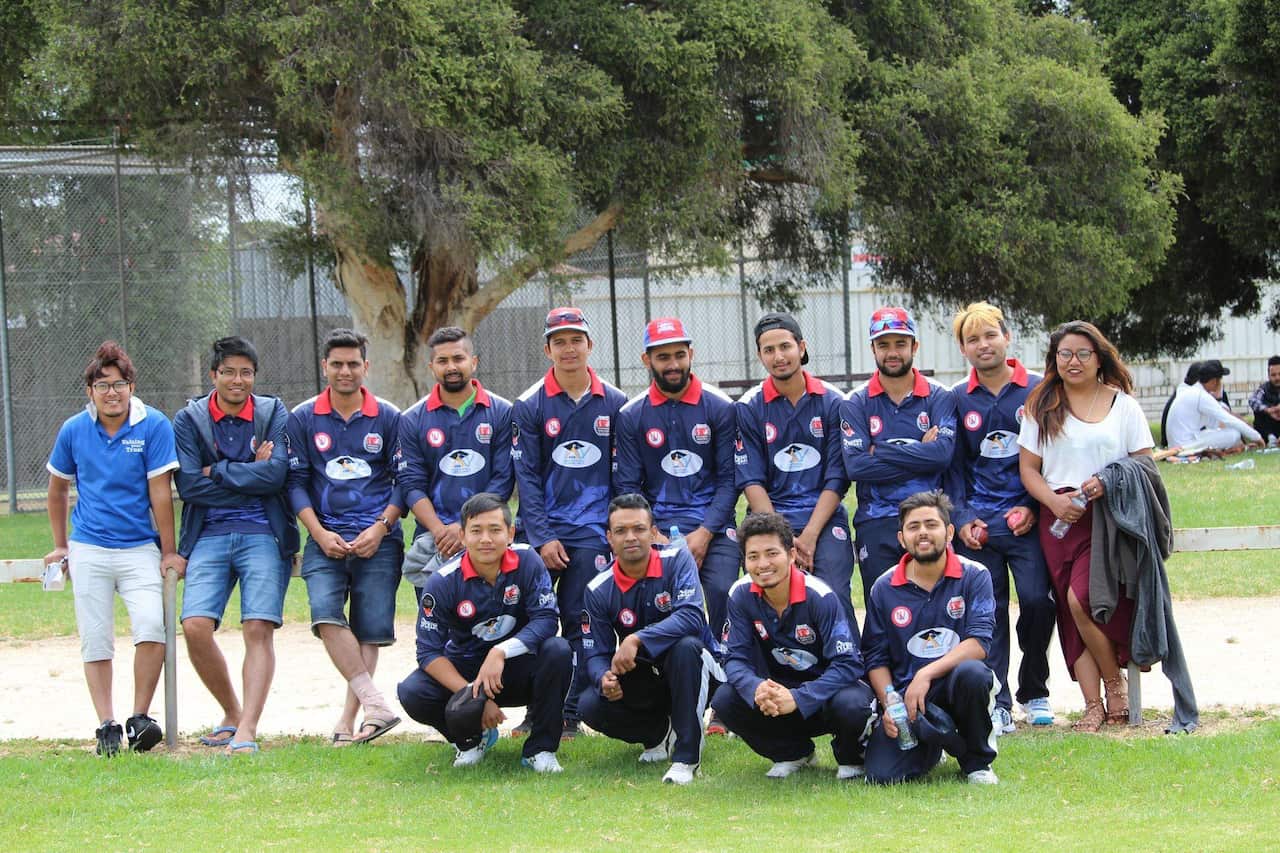 Sunam Gautam (standing 4th on left) with his Nepali community cricket team members.